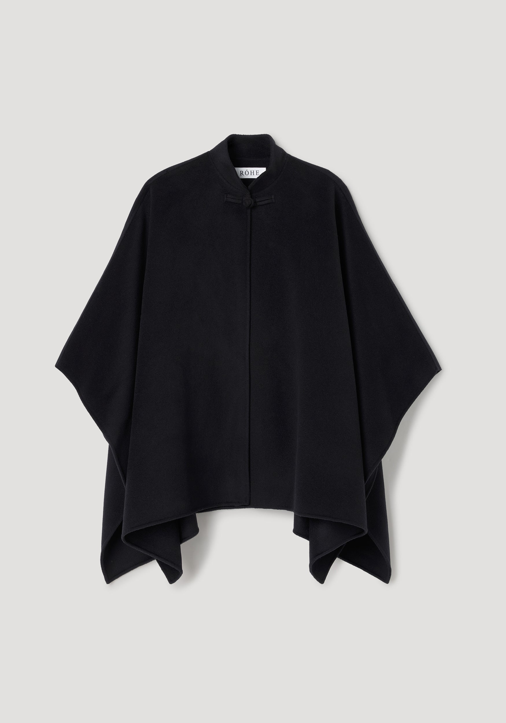 Black minimalist double-faced pankou poncho with a high collar and a single toggle closure, displayed flat against a neutral background, Double-faced pankou poncho | black.