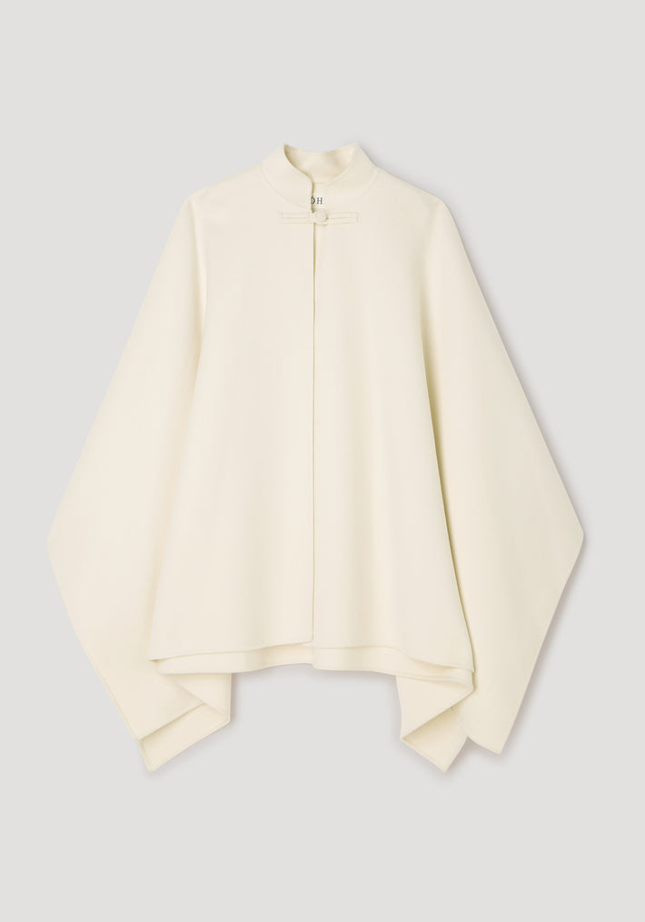 Double-faced pankou poncho | off white displayed on a plain background, featuring a high collar and traditional pankou knot closure with wide flowing sleeves.