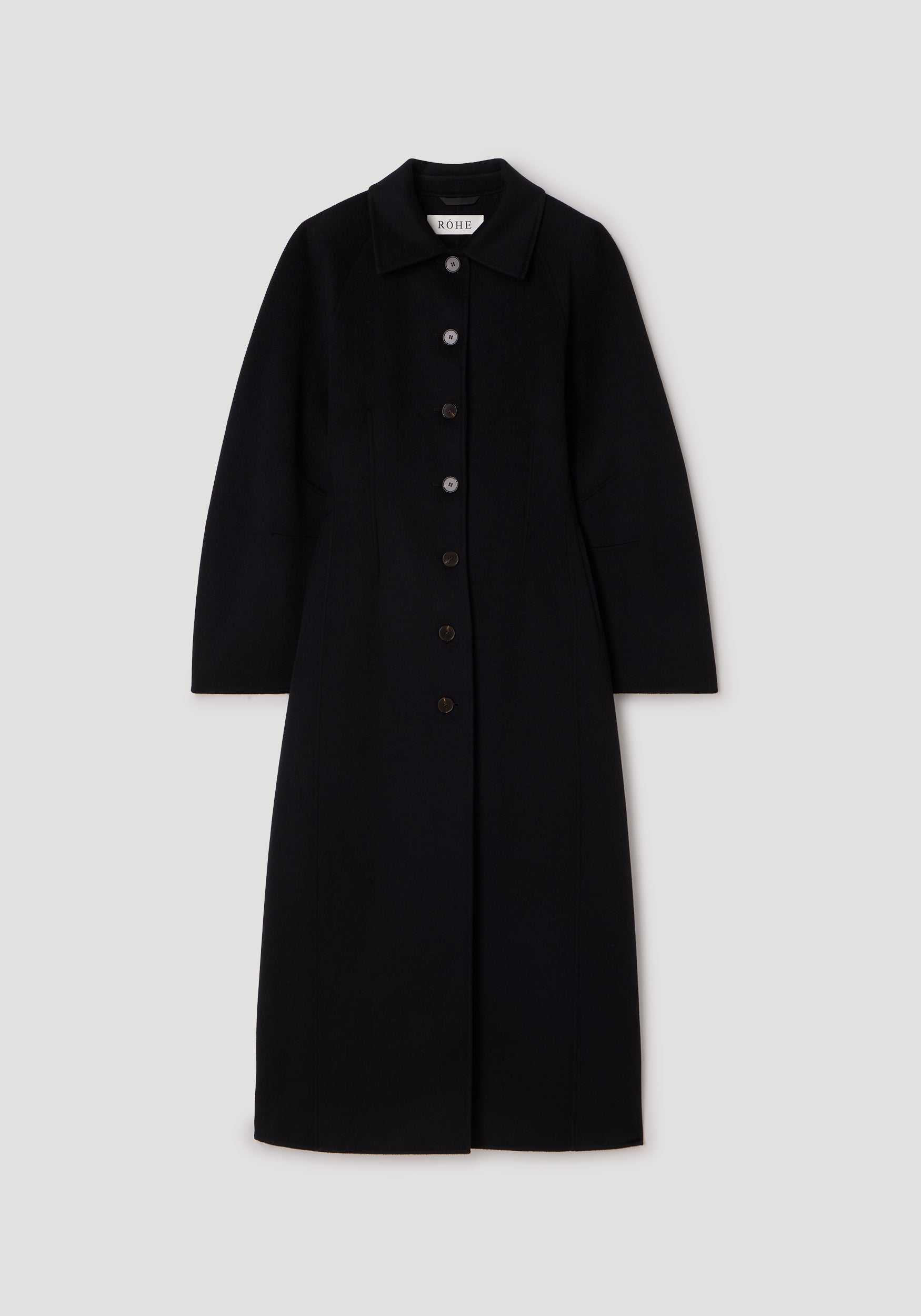 Black long coat with a button-down front and collar, featuring a tailored silhouette and clean lines, styled as the Double-faced elongated sculptural coat | black.