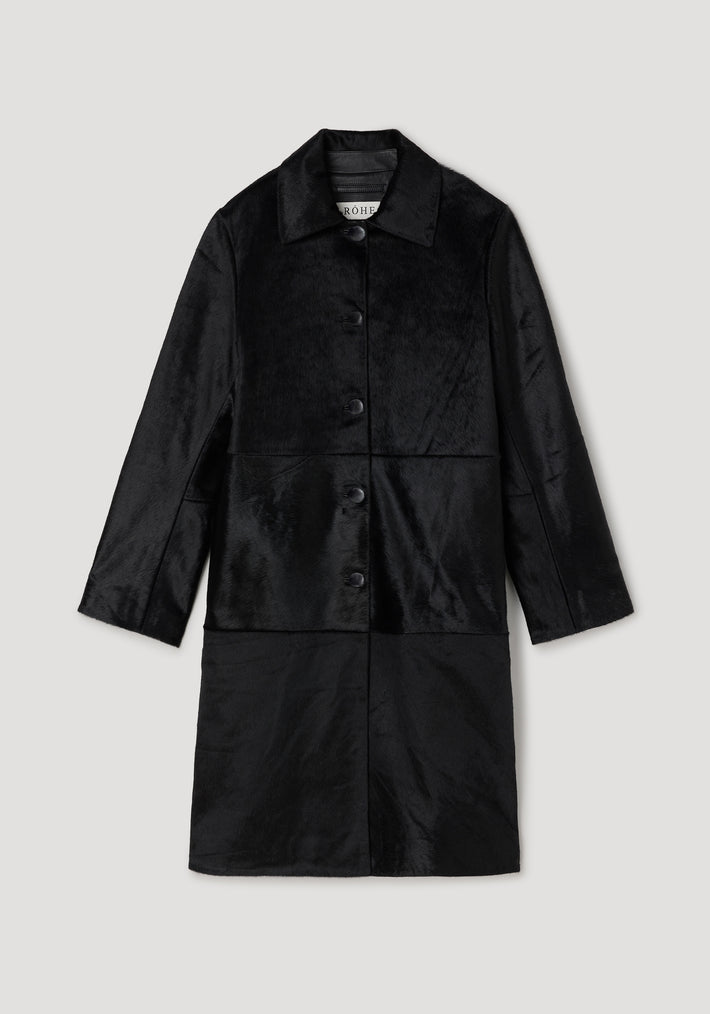 Black ponyhair coat | black with long sleeves, a collar, and front button closures, displayed on a light gray background.