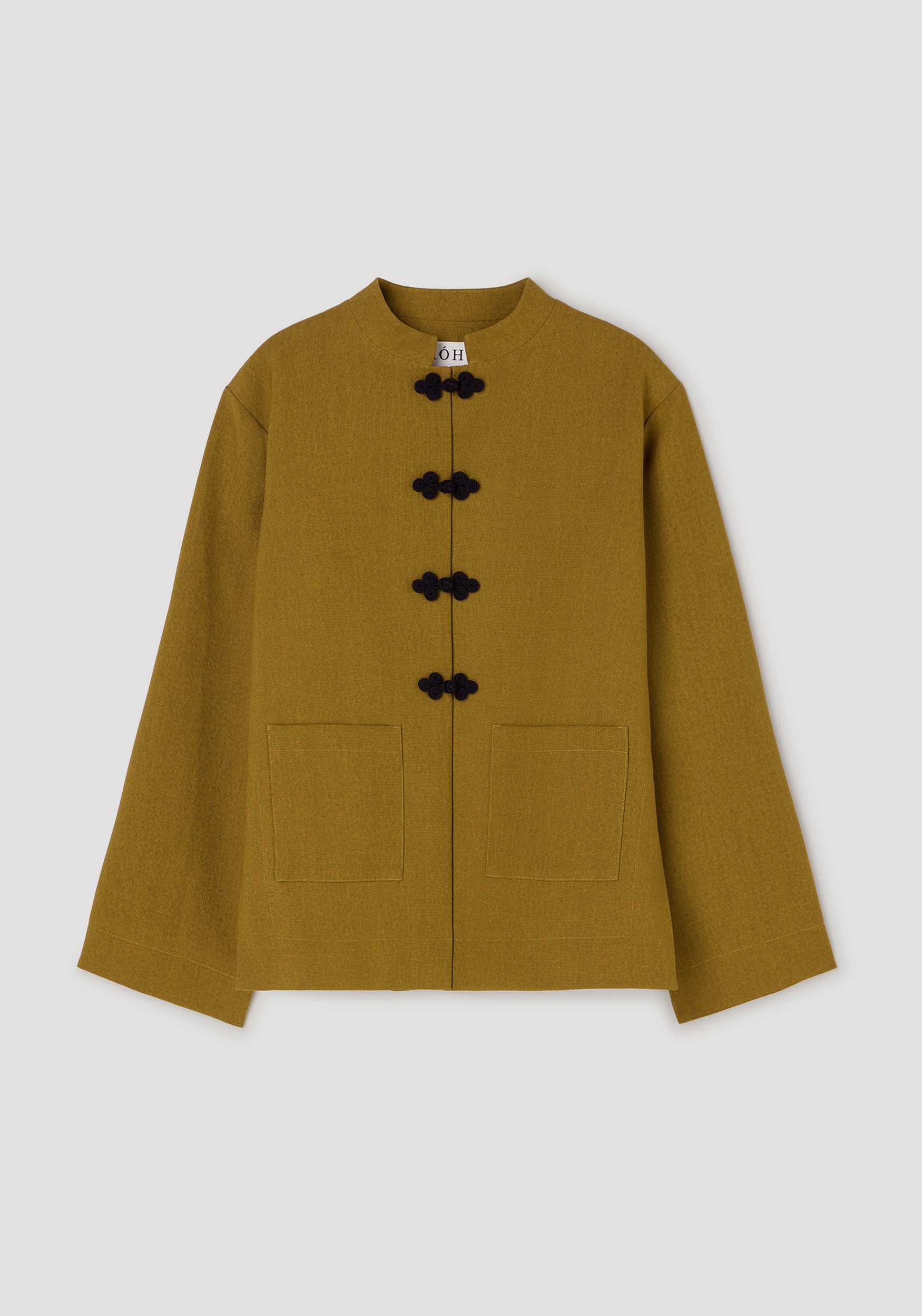 Pankou closure jacket | mustard featuring a straight cut, long sleeves, two front pockets, and traditional black pankou knot buttons on a stand collar.