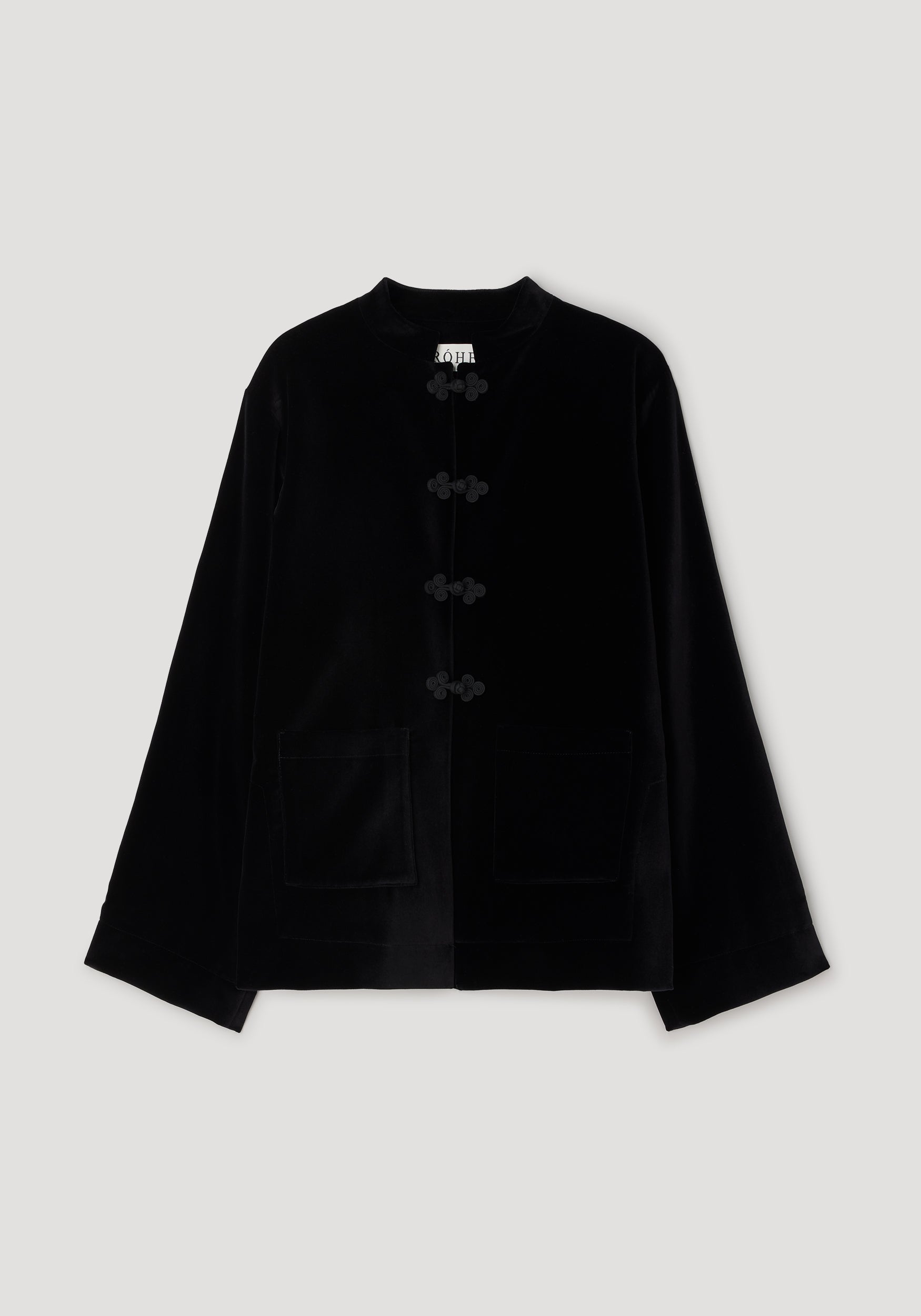 Pankou closure velvet jacket | black displayed flat, featuring a smooth velvet texture, traditional pankou button closures, long sleeves, a collarless neckline, and two front pockets on a neutral background.