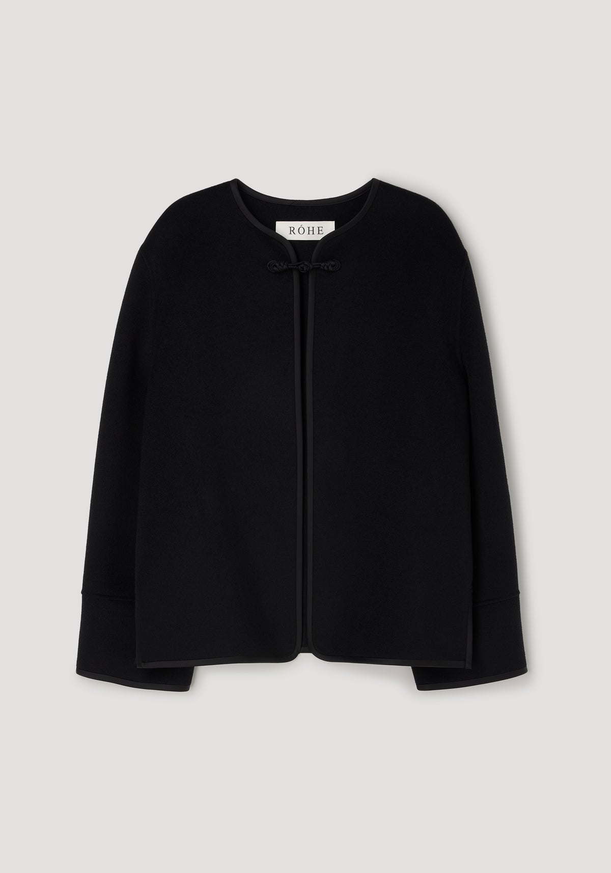 Black minimalist jacket with long sleeves and a rounded neckline, featuring a single pankou knot closure at the front, labeled Double-faced pankou jacket | black.