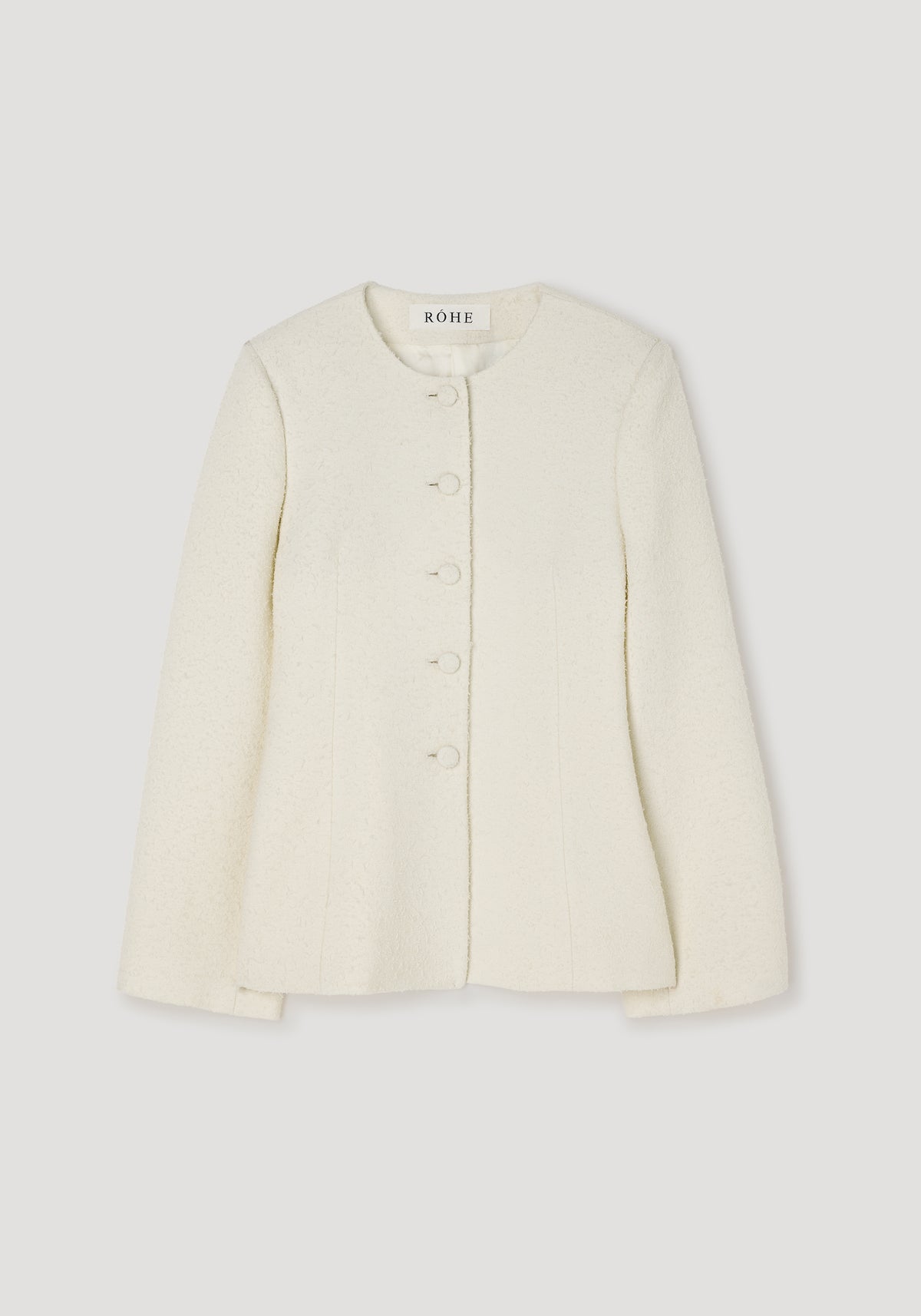 Bouclé shaped blazer | cream with a round neckline, long sleeves, and front buttons, made from textured fabric for a sophisticated and elegant look.