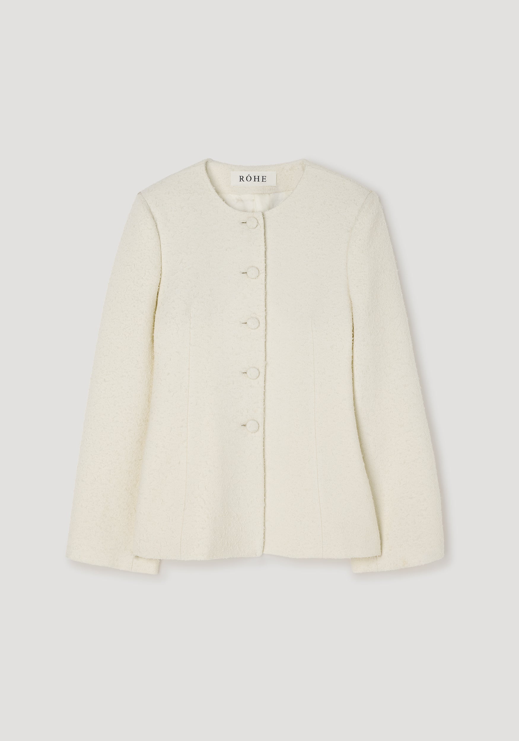 Bouclé shaped blazer | cream with a round neckline, long sleeves, and front buttons, made from textured fabric for a sophisticated and elegant look.
