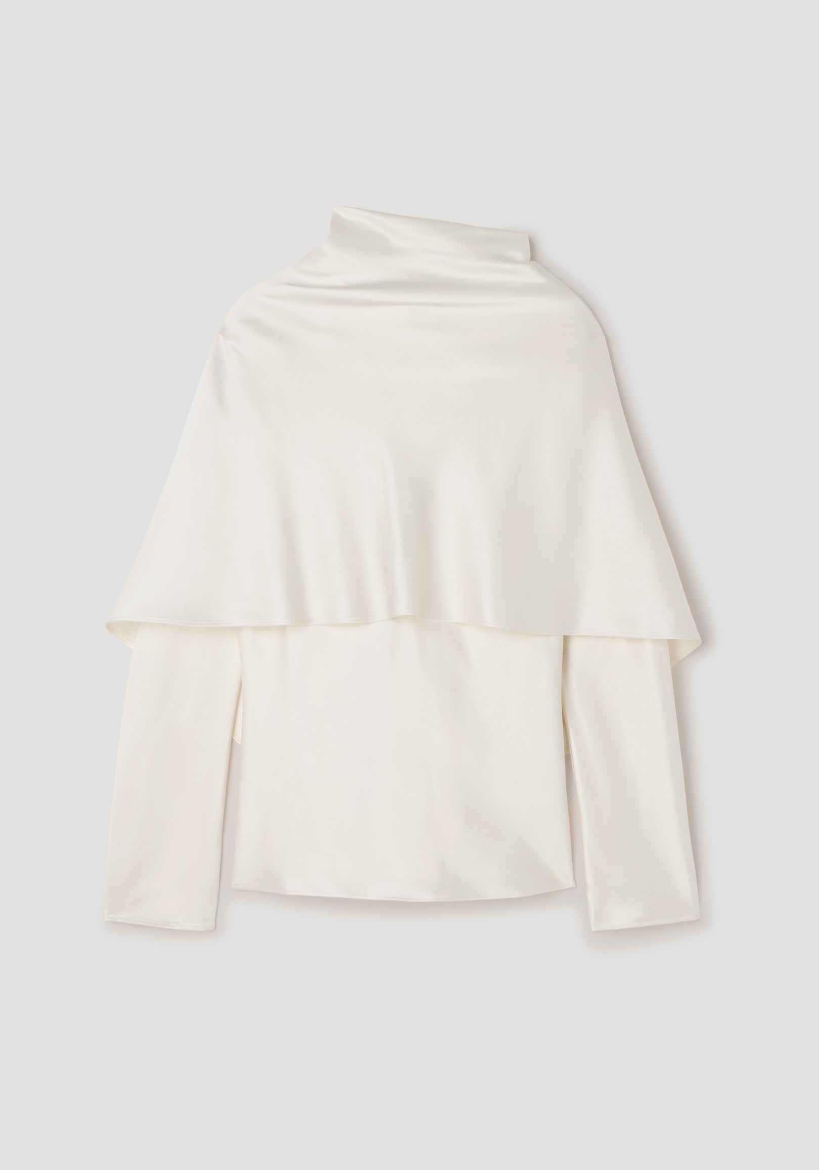 Satin cape top | cream in a smooth, flowing fabric with long sleeves and a high neckline, featuring an elegant cape detail draping over the shoulders.