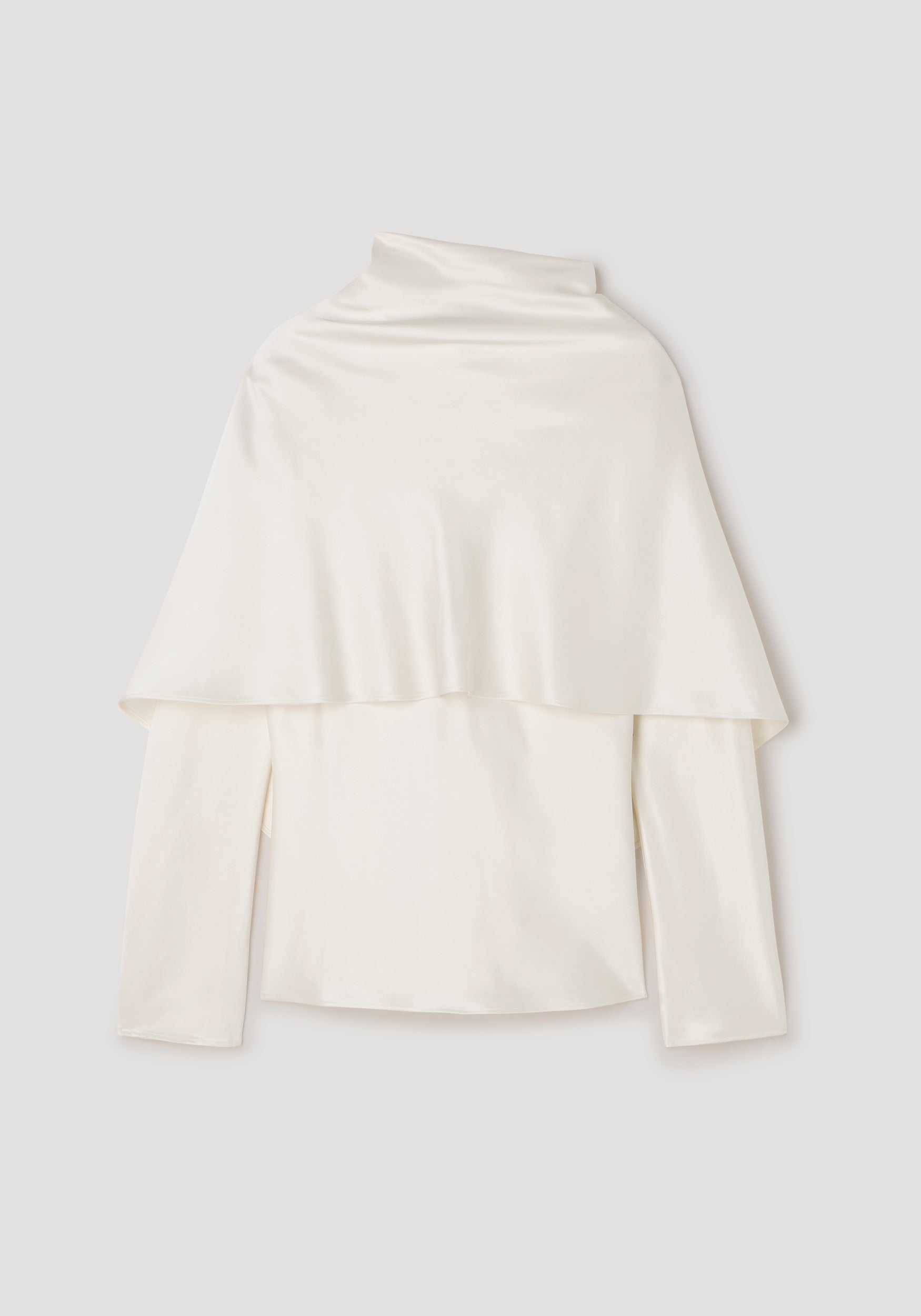 Satin cape top | cream in a smooth, flowing fabric with long sleeves and a high neckline, featuring an elegant cape detail draping over the shoulders.