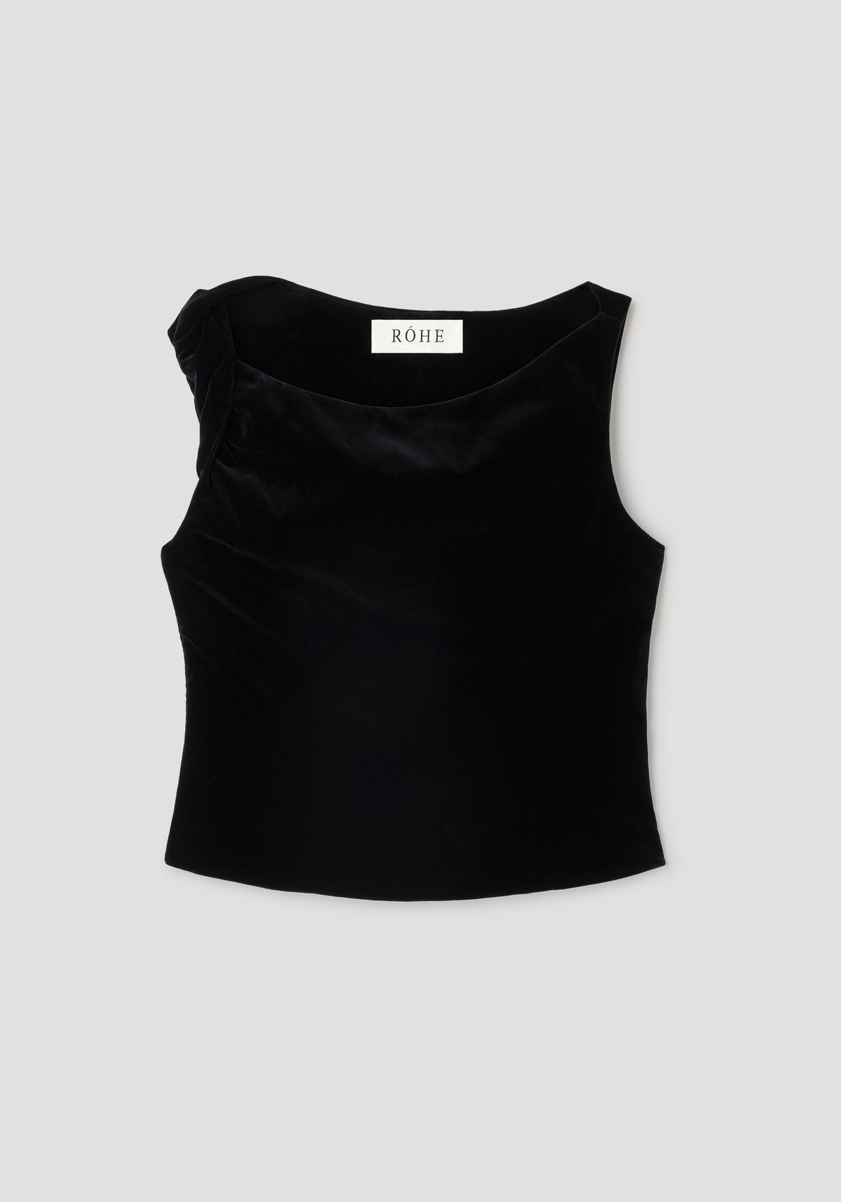 Draped velvet top | black displayed flat, featuring a sleeveless design with a subtle draped detail on one shoulder, made from smooth black velvet fabric.