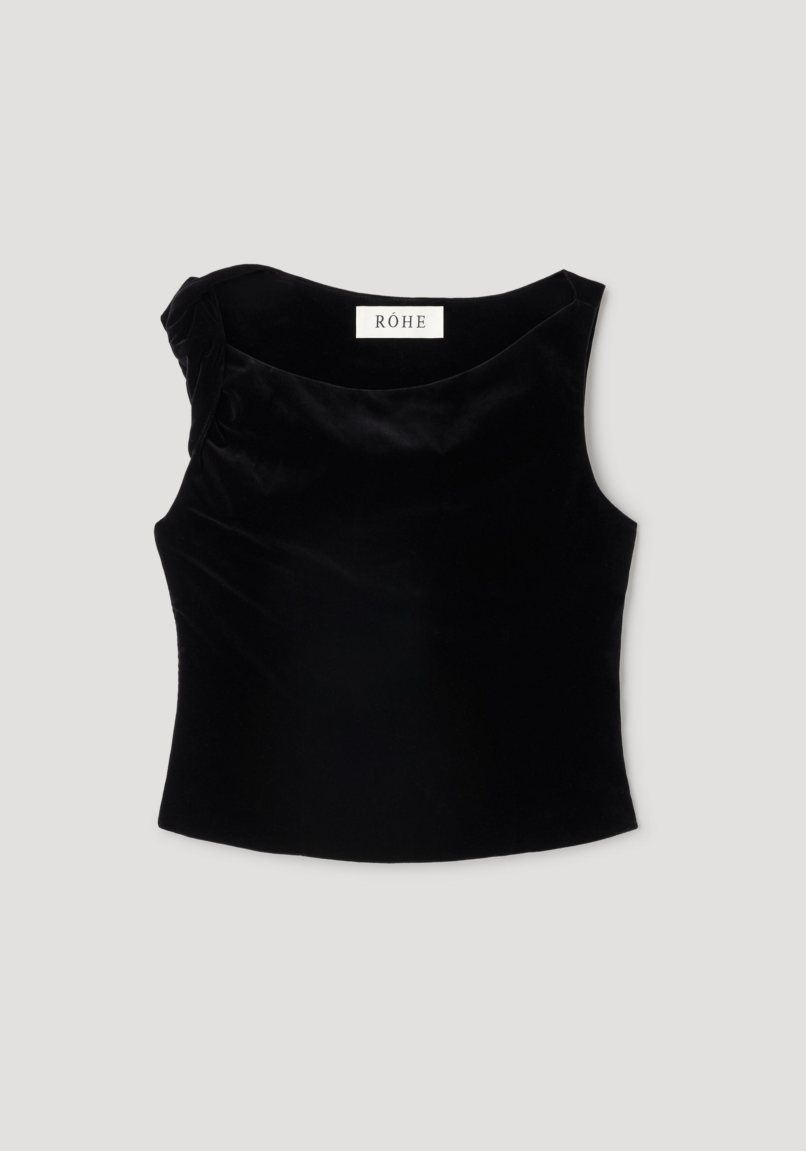 Draped velvet top | black displayed flat, featuring a sleeveless design with a subtle draped detail on one shoulder, made from smooth black velvet fabric.