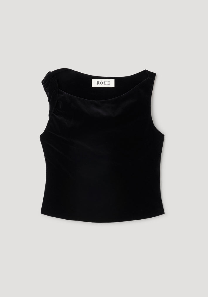 Draped velvet top | black displayed flat, featuring a sleeveless design with a subtle draped detail on one shoulder, made from smooth black velvet fabric.