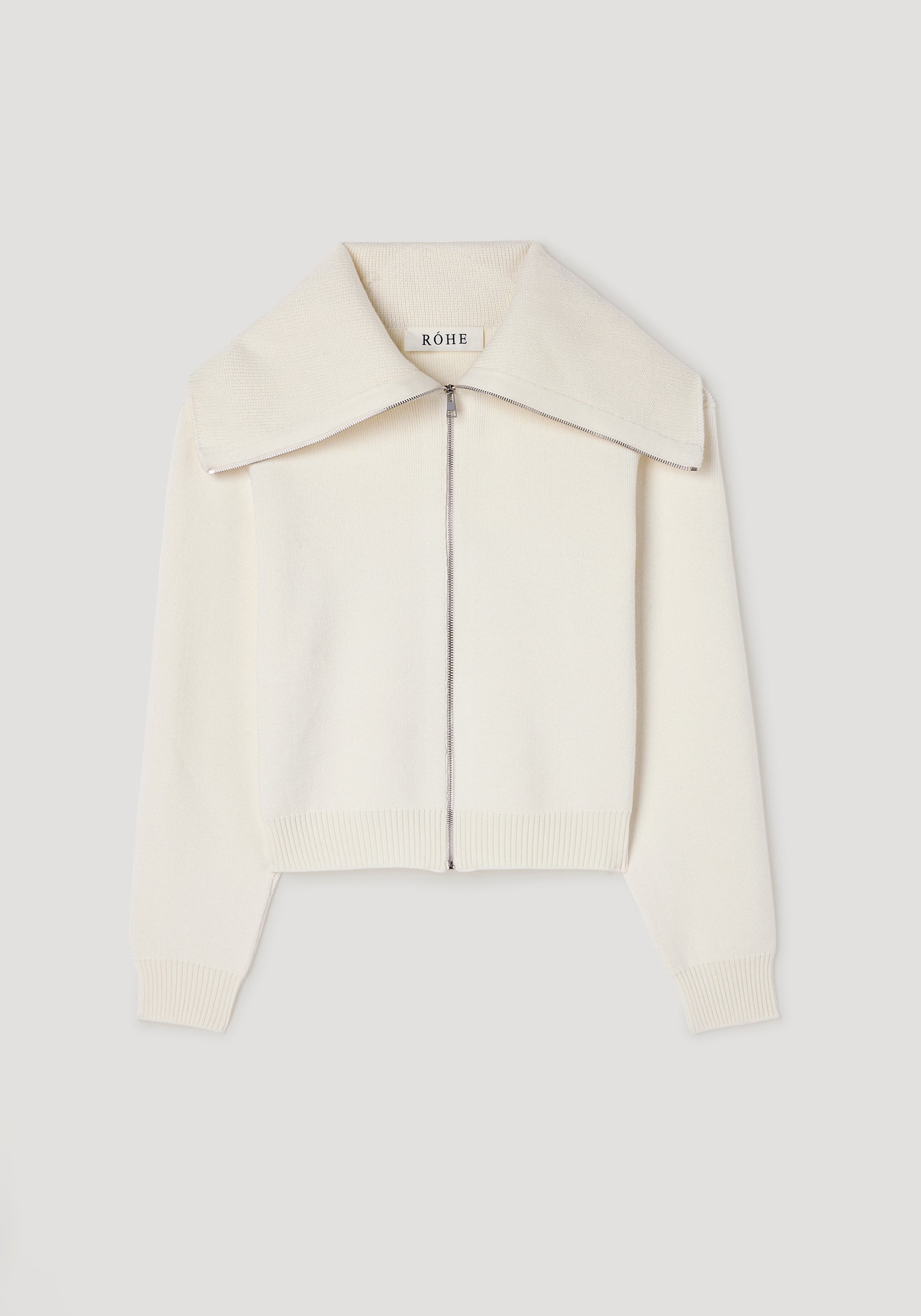 Cream-colored knitted zip-up cardigan with a wide sailor collar and ribbed cuffs and hem, styled in the Two way sailor zip cardigan | cream design.