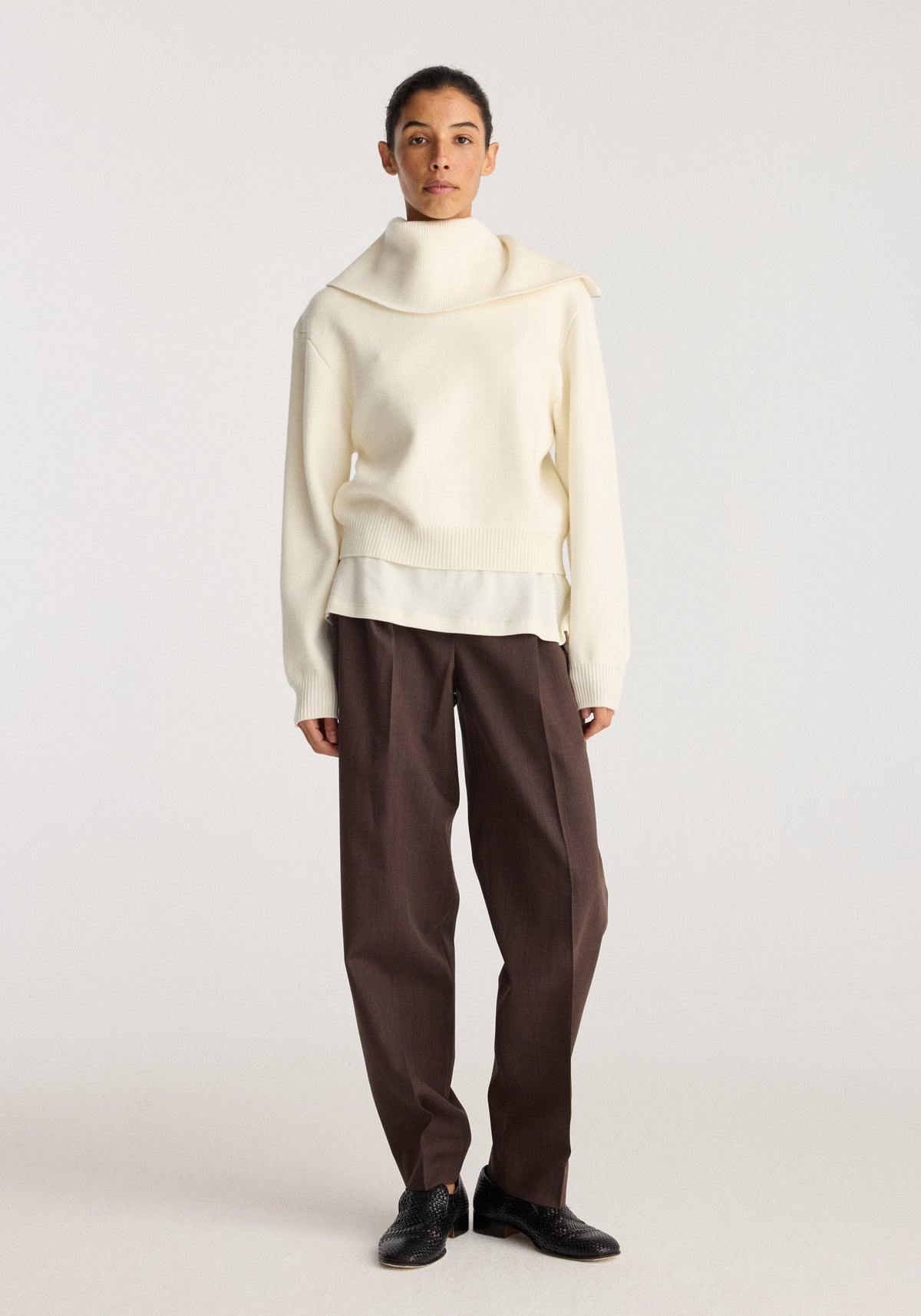 Reversible sailor zip cardigan | cream worn by a model with a sailor collar and relaxed fit styled with brown trousers and black shoes