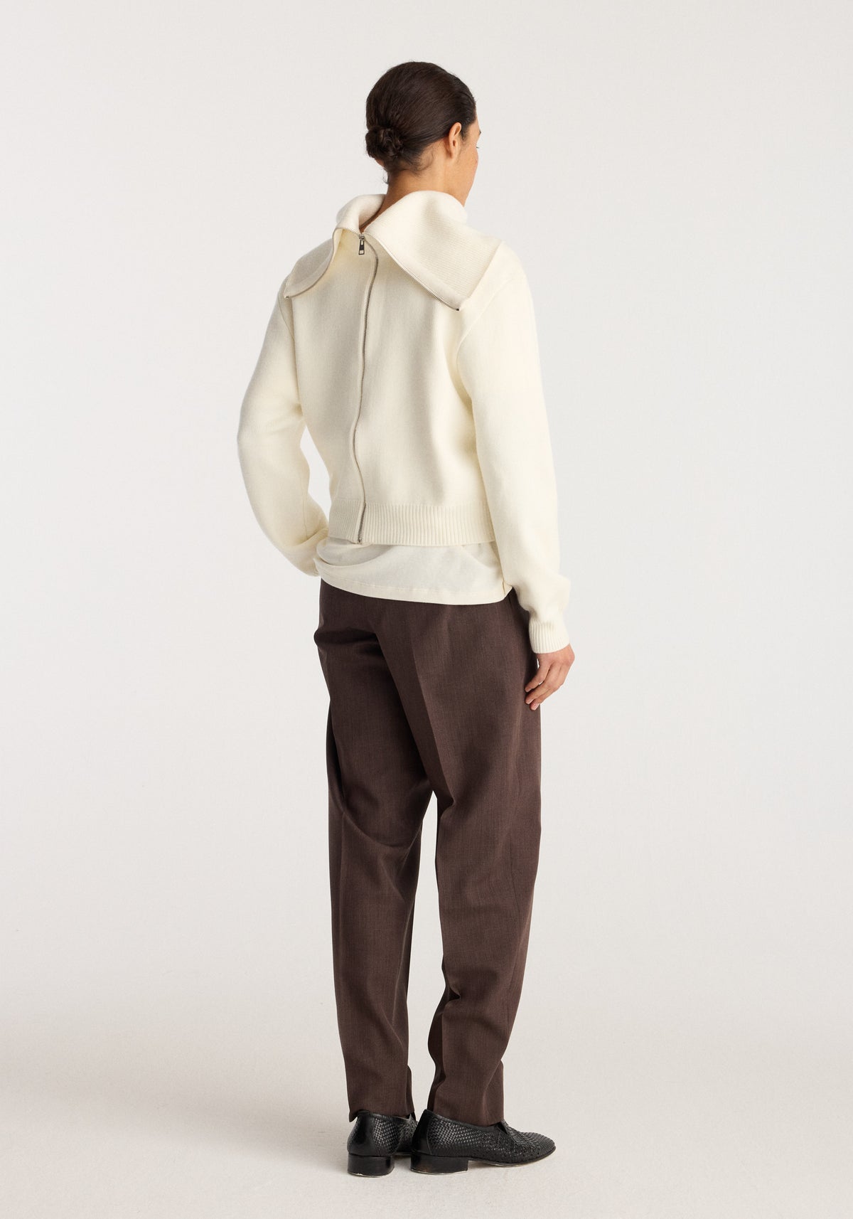Reversible sailor zip cardigan | cream shown from the back on a model with a hood and zip closure in a soft cream knit fabric