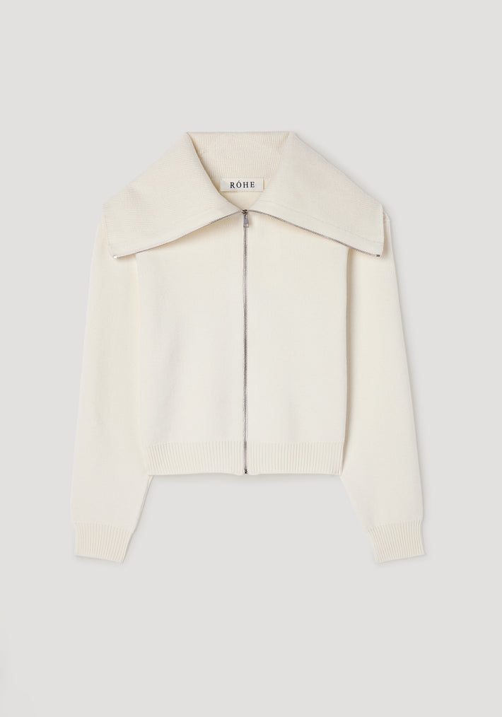 Cream-colored knitted zip-up cardigan with a wide sailor collar and ribbed cuffs and hem, styled in the Two way sailor zip cardigan | cream design.