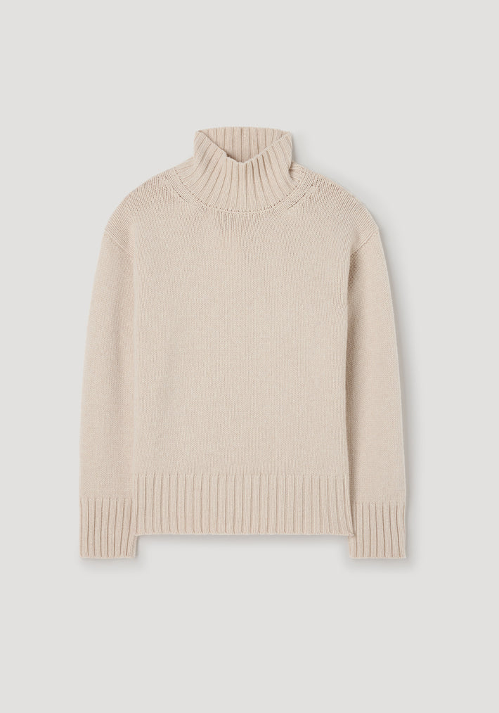 Wool-cashmere turtleneck | oat, a soft knit sweater featuring a ribbed turtleneck, cuffs, and hem in a light beige color designed for warmth and comfort.