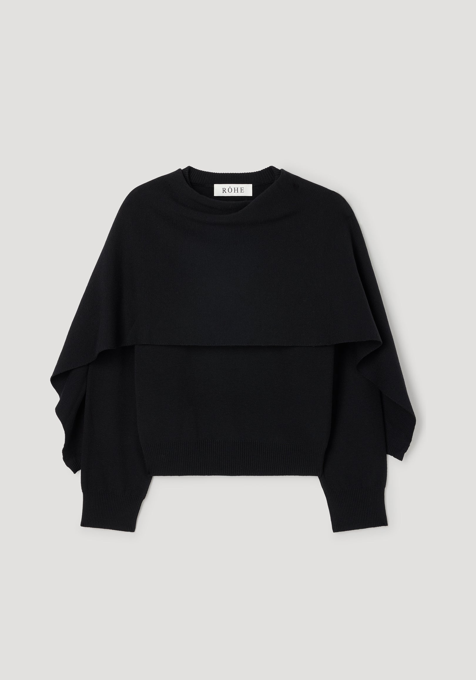 Cape jumper | black displayed flat on a light background, featuring a layered design with wide, loose sleeves and a ribbed hem.