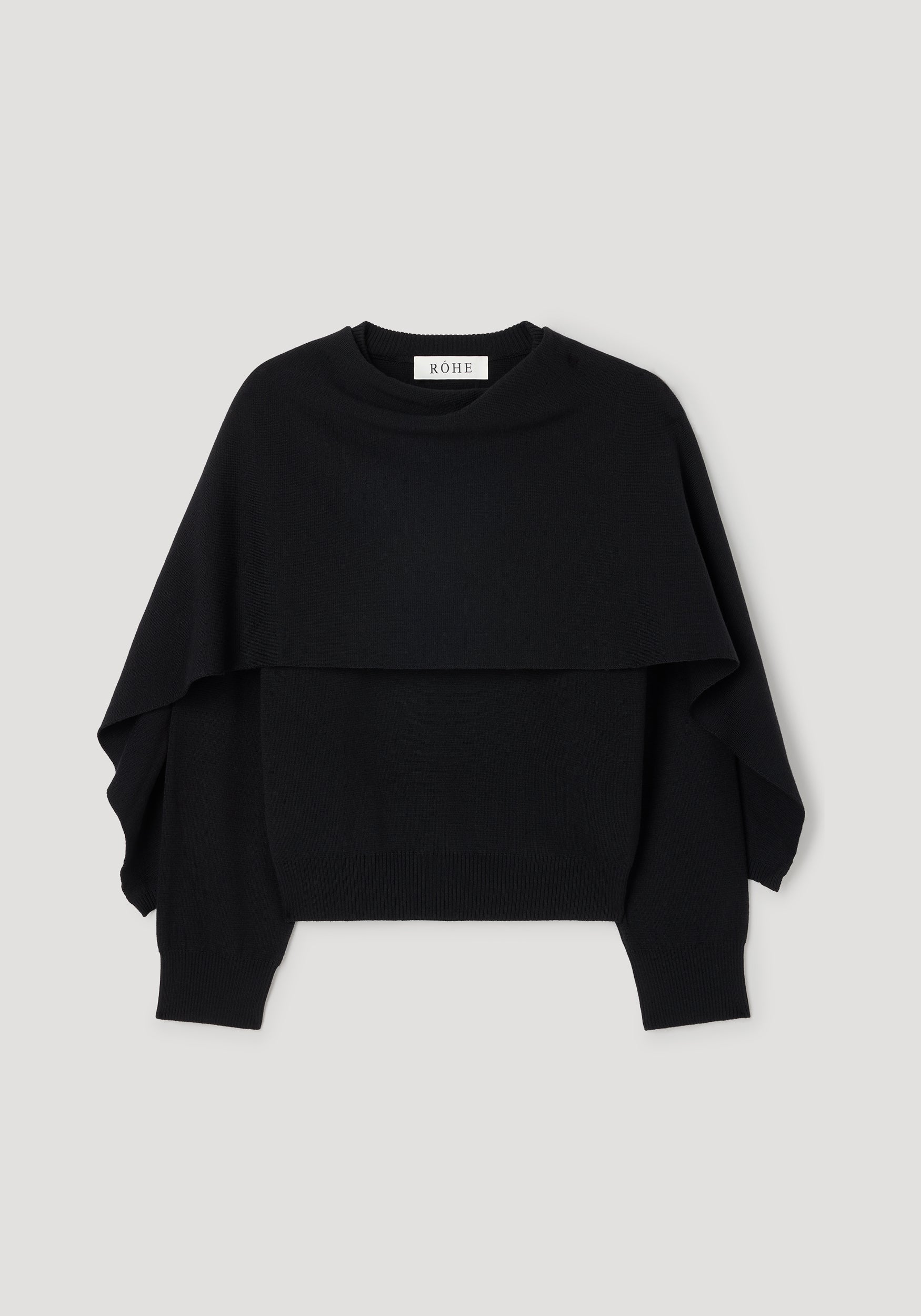 Cape jumper | black displayed flat on a light background, featuring a layered design with wide, loose sleeves and a ribbed hem.
