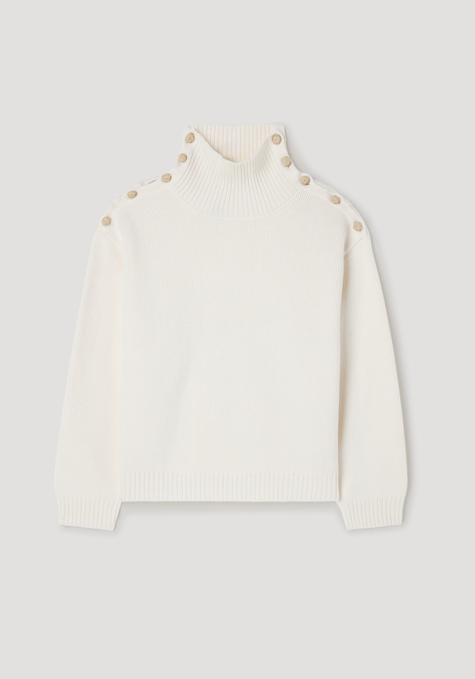 Cream-colored knit sweater with high ribbed neck and button details along the shoulders, designed in the style of Uneven sailor polo | cream.