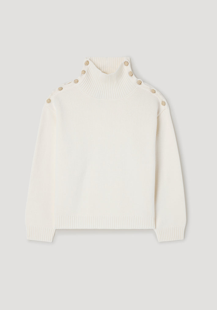 Cream-colored knit sweater with high ribbed neck and button details along the shoulders, designed in the style of Uneven sailor polo | cream.