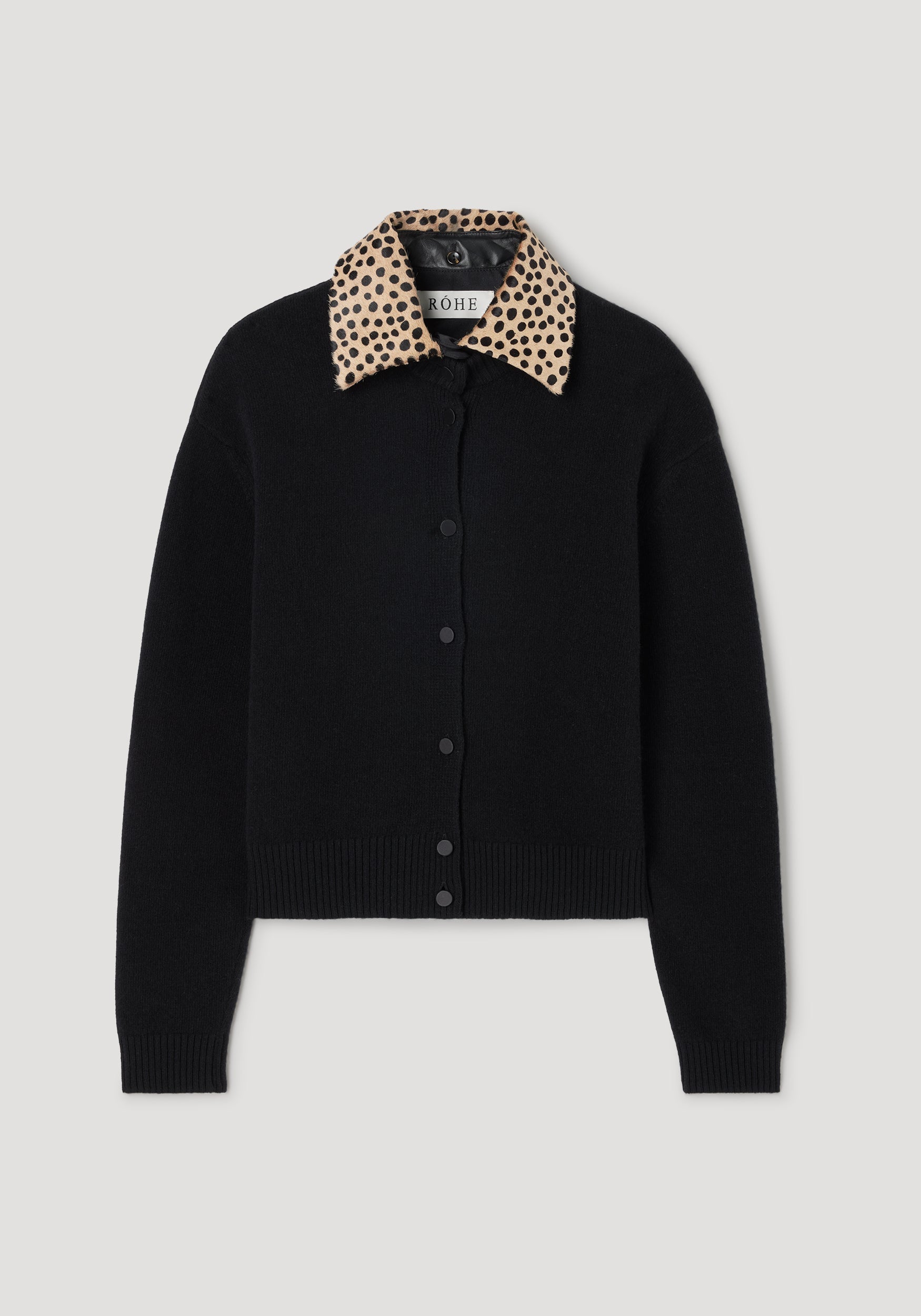 Cheetah collar cardigan | black featuring a solid black knit body with a contrasting beige cheetah print collar and front button closure.
