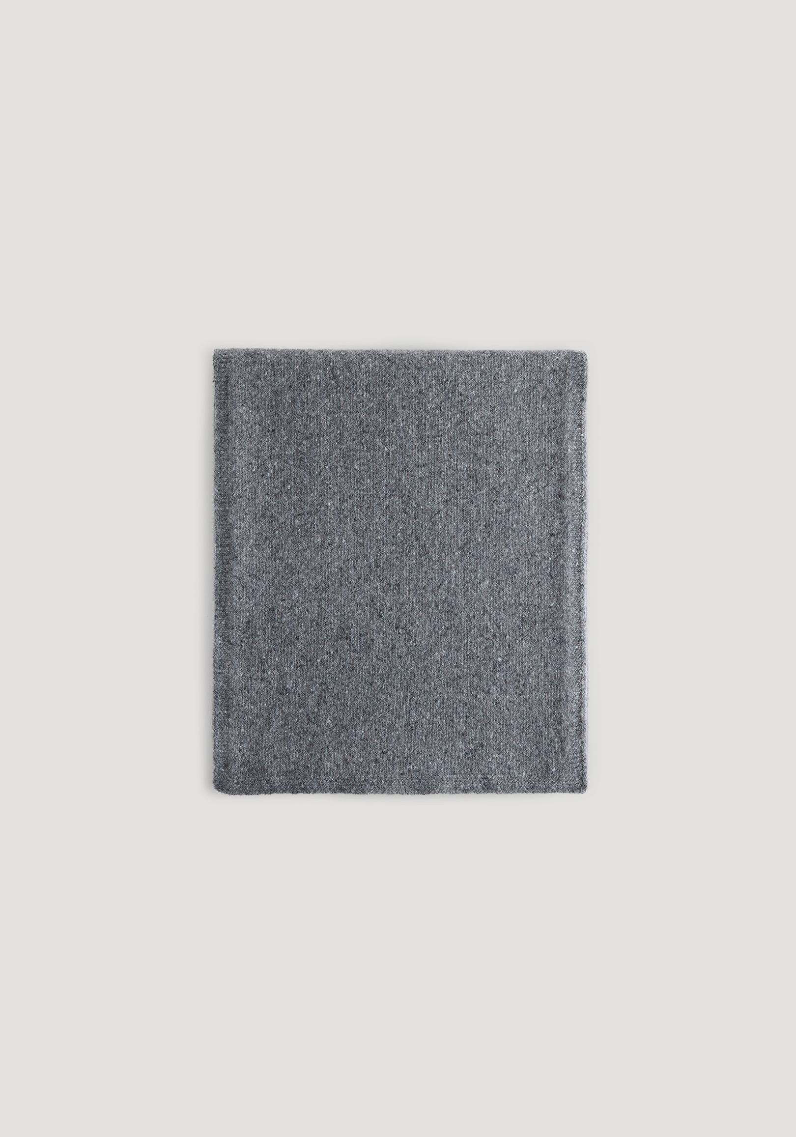 Knitted mouliné scarf | anthracite melange neatly folded on a light background, showing its soft textured fabric in a dark gray shade.