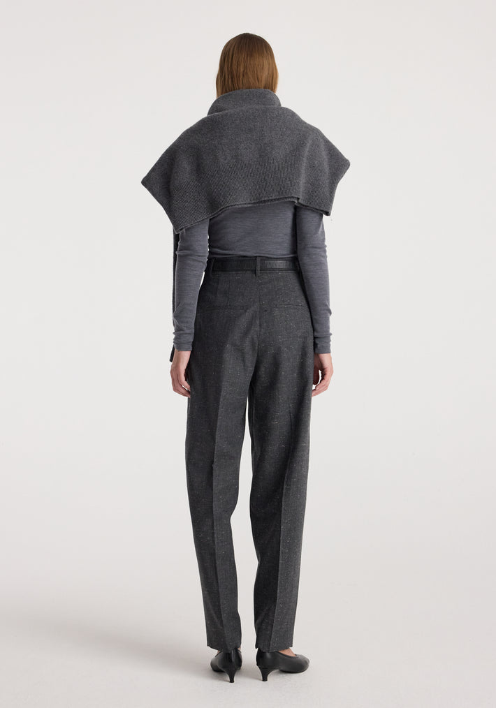 Woman seen from behind wearing Daria - Single pleat straight leg trousers | grey slub paired with a long-sleeve top and a draped shawl over the shoulders.