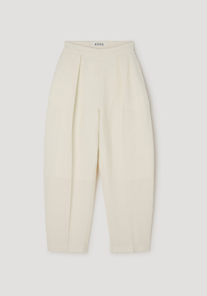 Puck - Sculptural bouclé tailored trousers | cream shown flat, featuring a high waist, pleated front, and textured soft bouclé fabric for an elegant silhouette.