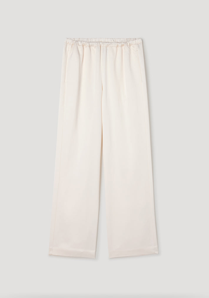 Relaxed fit satin trousers | cream in a soft cream color with an elastic waistband and wide leg design, made from smooth satin fabric for comfortable and stylish wear.
