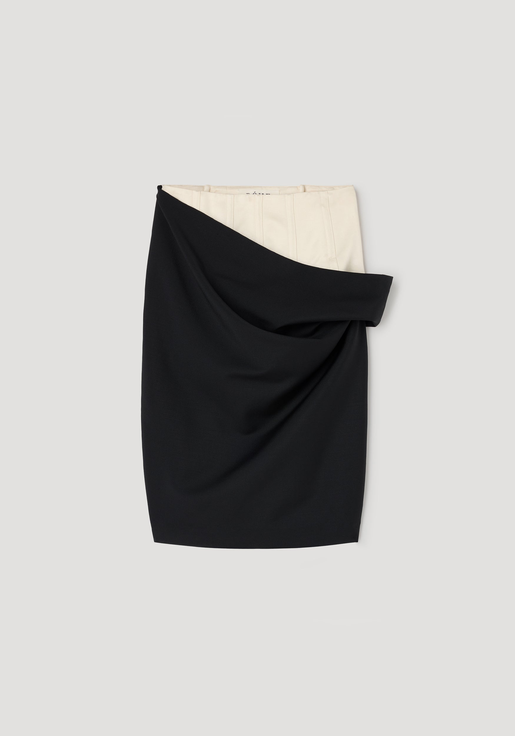 Double waistband skirt | black featuring a sleek black outer layer draped over a contrasting light inner waistband for a modern, structured look.