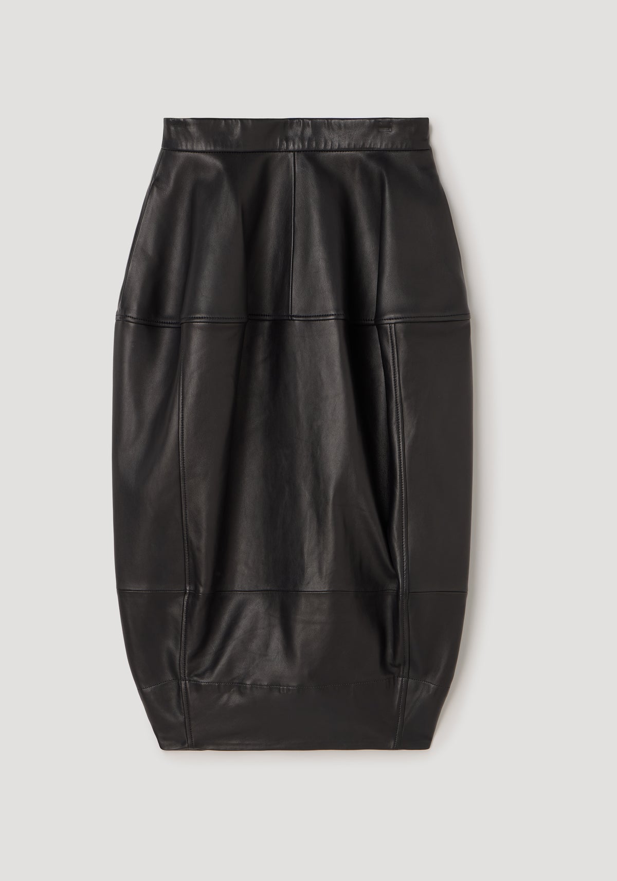 Sleek black leather skirt with sculptural seamless design and subtle stitching, showcasing a modern, structured silhouette called Sculptural leather skirt | black.