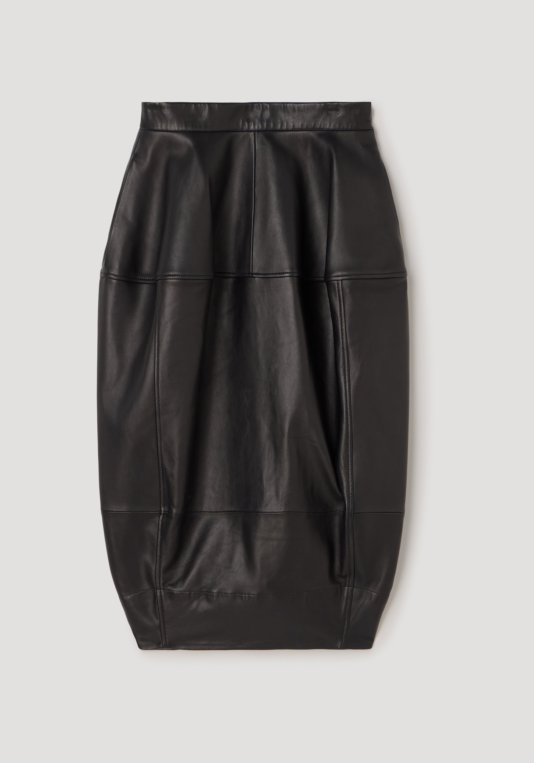 Sleek black leather skirt with sculptural seamless design and subtle stitching, showcasing a modern, structured silhouette called Sculptural leather skirt | black.