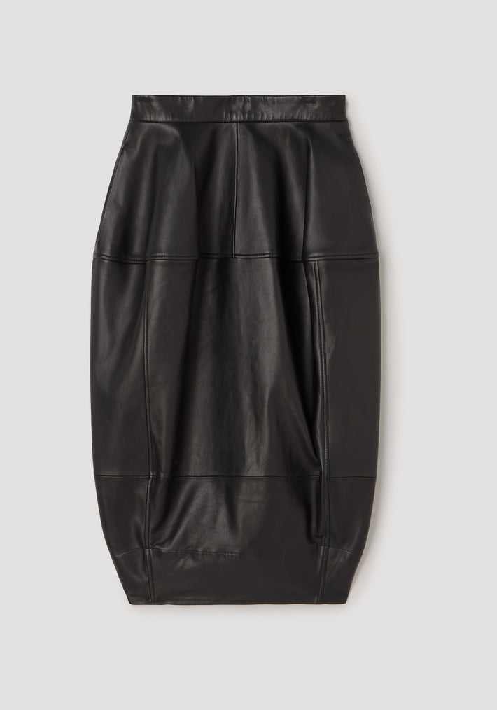 Sleek black leather skirt with sculptural seamless design and subtle stitching, showcasing a modern, structured silhouette called Sculptural leather skirt | black.