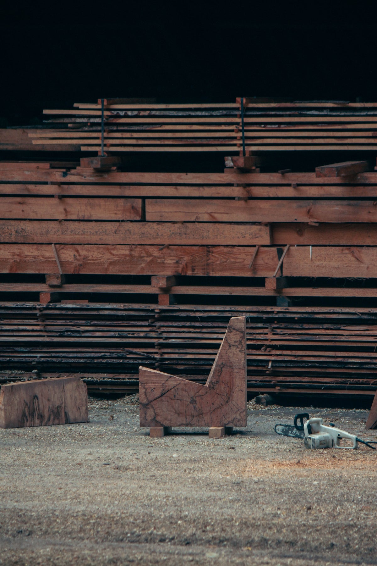 Brutalist Chair | 5788: Inside a sawmill, rough oak blocks and a chainsaw hint at the handcrafted process of this unique, sculptural chair by Arne Kristian.