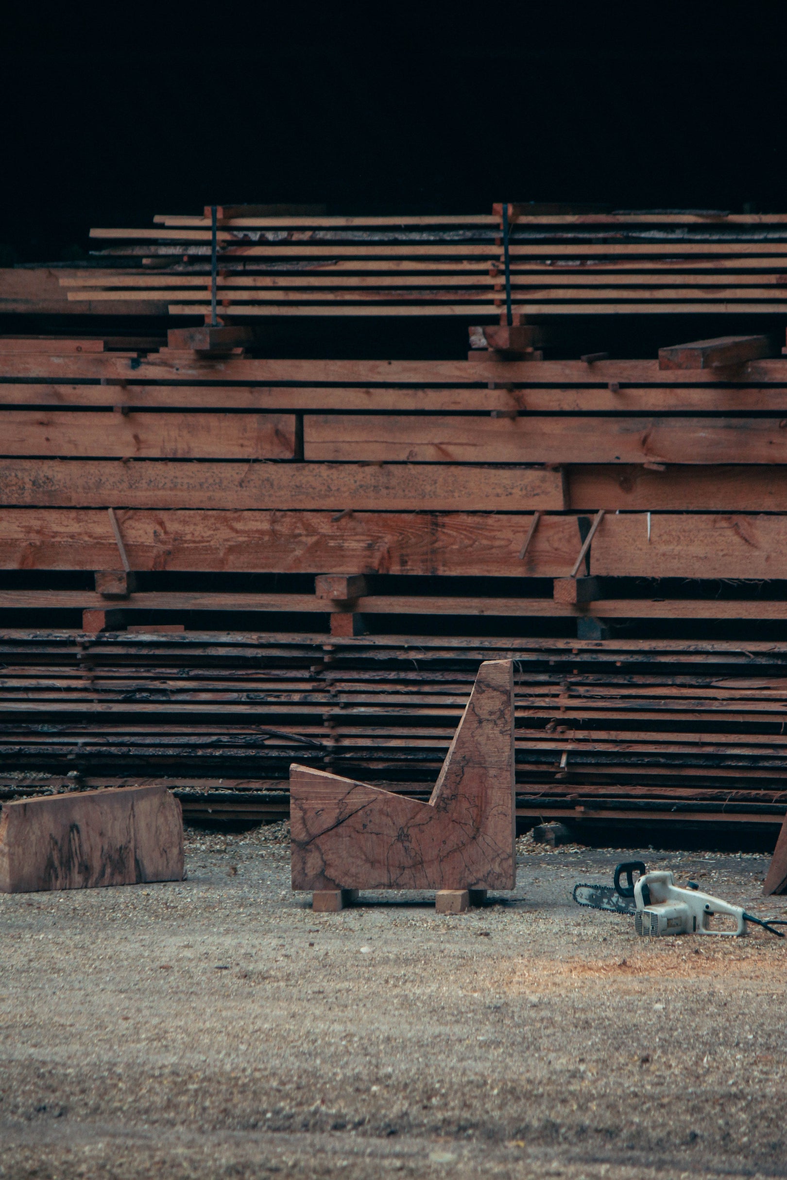 Brutalist Chair | 5788: Inside a sawmill, rough oak blocks and a chainsaw hint at the handcrafted process of this unique, sculptural chair by Arne Kristian.