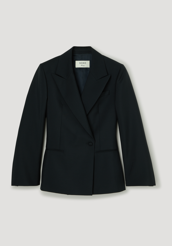Hourglass shaped blazer | navy, features tailored black blazer with peaked lapels, single-button closure, cinched waist, and side pockets, emphasizing a sculptural silhouette.