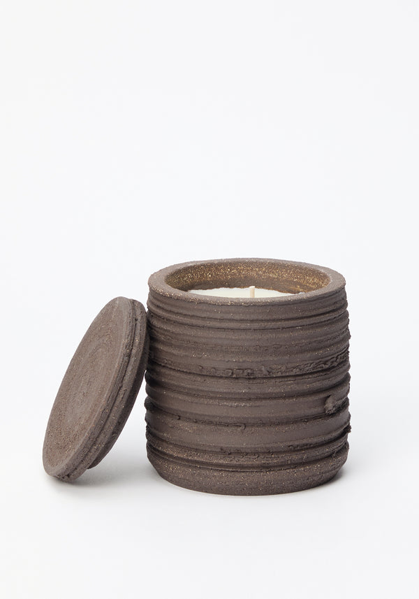 Diplomatico Scented Candle | soil: A handmade earthenware jar with lid, featuring ridged texture, white wax, and wick; doubles as sage-burning coaster.