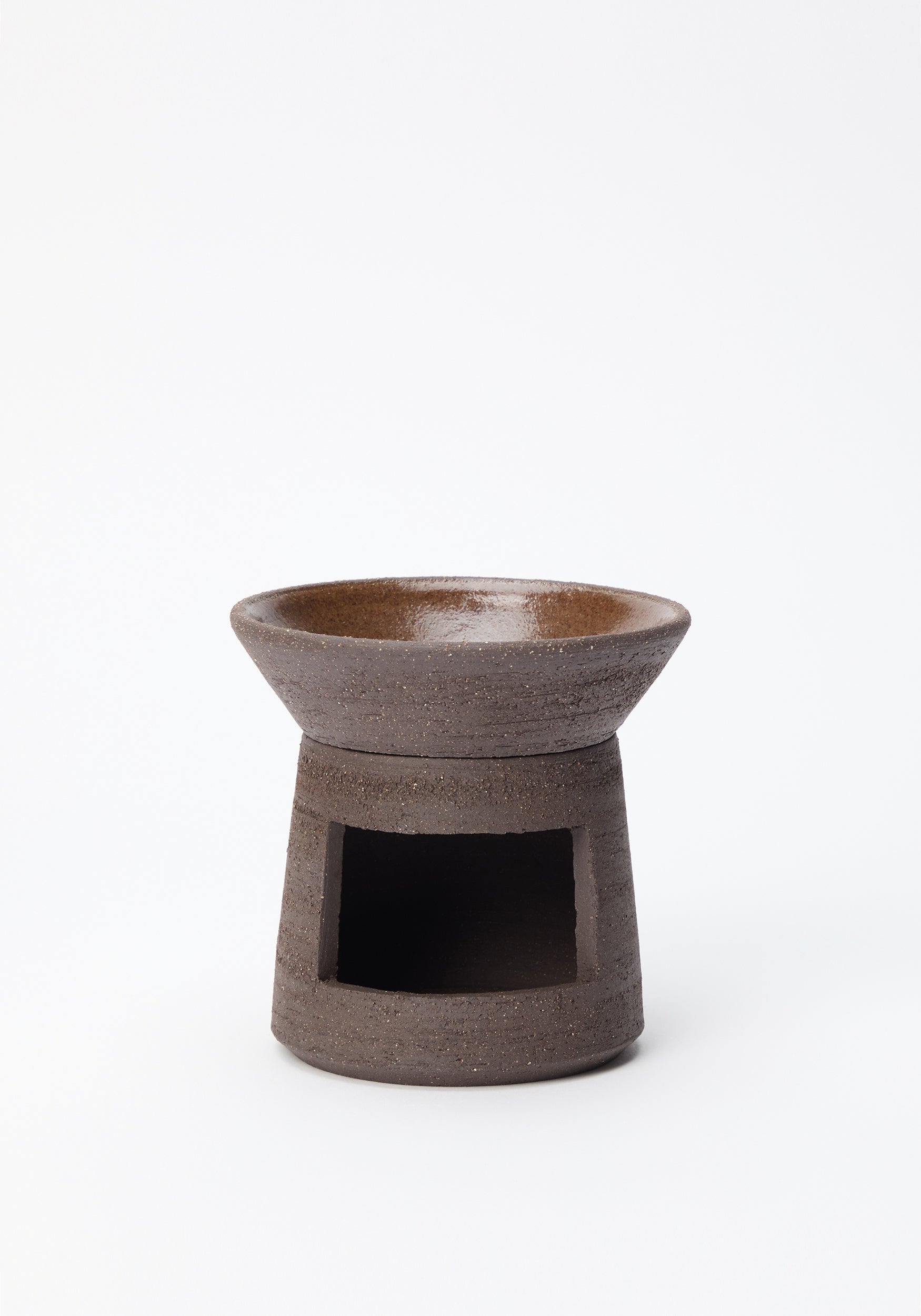 Minimalist dark brown ceramic oil burner with a matte textured finish and an open space for a tealight candle, designed for home fragrance use, Ceramic Oil Burner | soil.