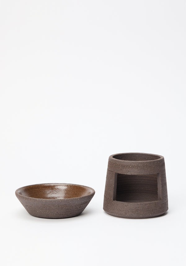 Ceramic Oil Burner | soil: A handmade stoneware diffuser, featuring a shallow bowl atop a hollow base with a cut-out for a tealight, crafted by Alex Gabriels.