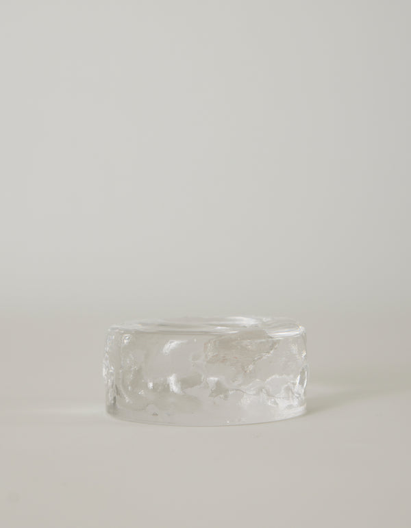 Presse-papier & holder by Szkło Studio: A clear, rippled, glass-like cylinder, showcasing handcrafted, unique design with a raw, crystalline appearance.