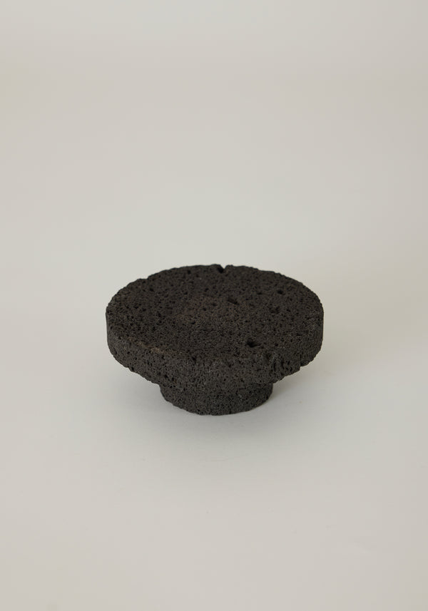 Elevated Sculptural Tray crafted from lava stone, featuring a porous texture with a circular design and smaller base, handcrafted by Louis Crombag in the Netherlands.