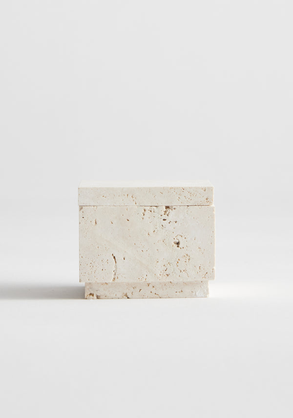 Tealight box | travertine: A small, handcrafted travertine box with lid, showcasing natural texture and pitting, designed for tealight or versatile use, on a white background.