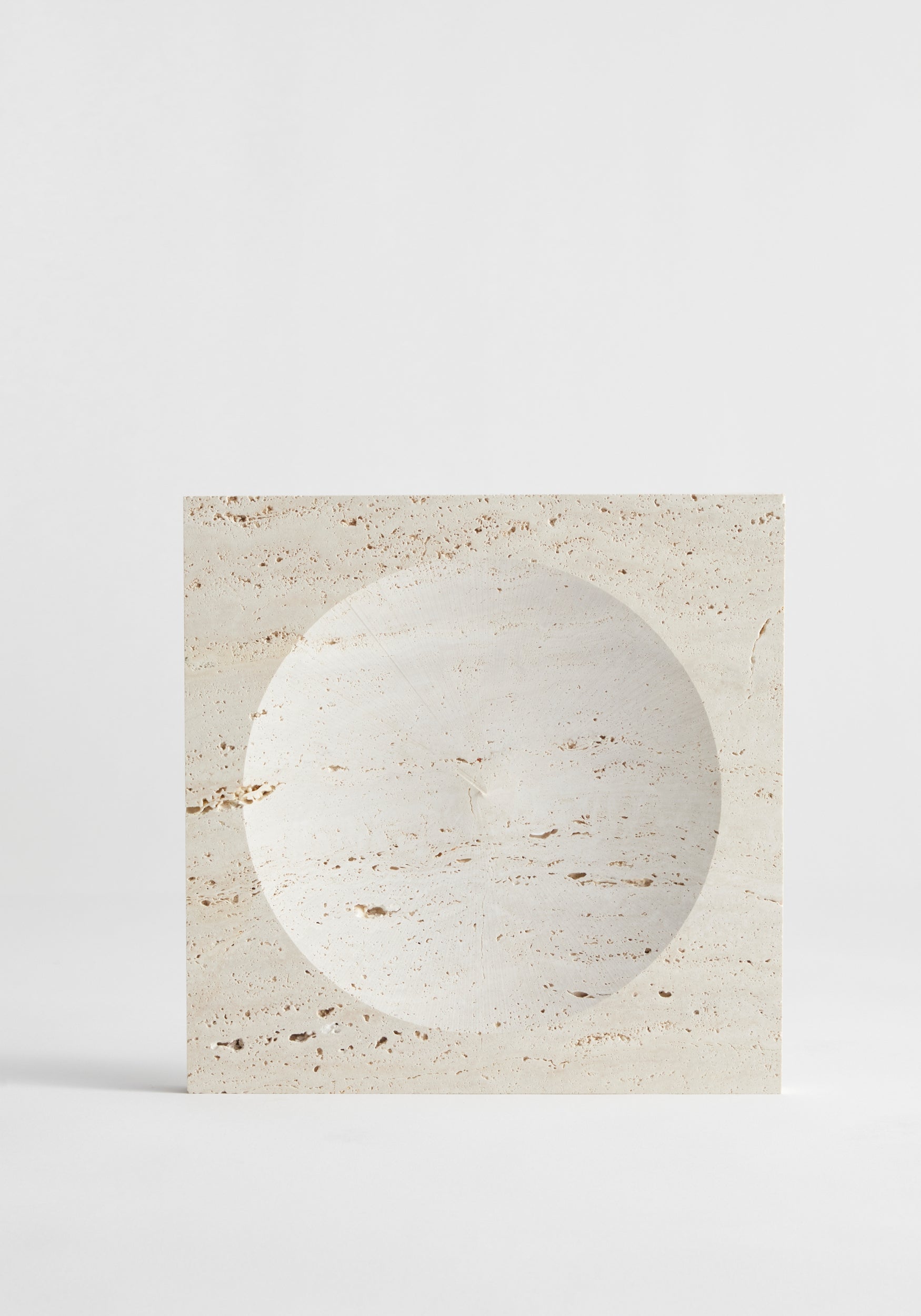 Medium tray | travertine with a smooth, round recessed center and natural beige stone texture, displayed on a plain light background.