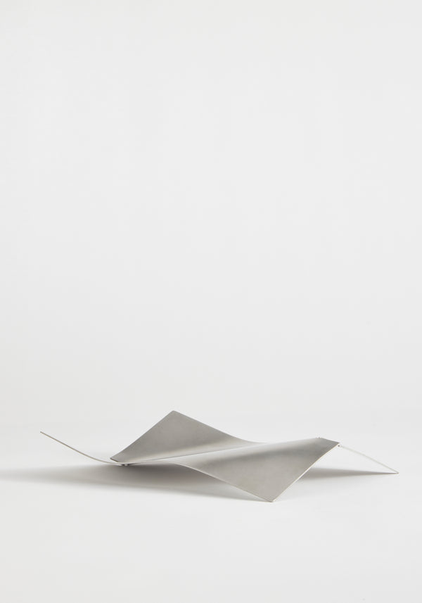 Stainless steel bowl in a saddle-like, minimalist form, crafted from a thin, bent sheet. Collaboration with Dutch designer Paul Coenen, handcrafted in the Netherlands.