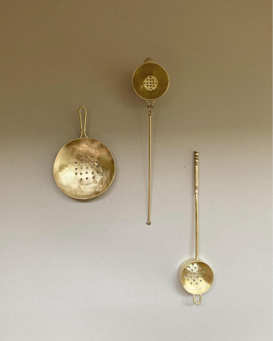 Tea Strainer set: three handcrafted brass strainers by Misae Nikkei, featuring shallow, perforated bowls and slender handles, ideal for tea or culinary use.