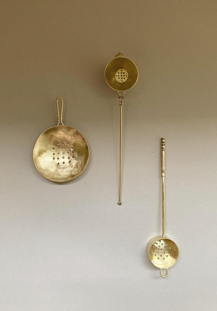 Tea Strainer set: three handcrafted brass strainers by Misae Nikkei, featuring shallow, perforated bowls and slender handles, ideal for tea or culinary use.