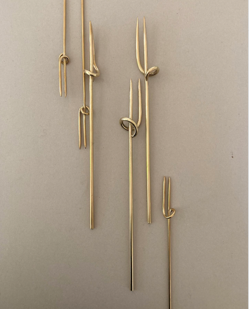 Vine Fork: Handcrafted gold-tone metal skewers with two prongs and a sliding ring, designed by Kyoto artist Nikke Misae for securing appetizers.