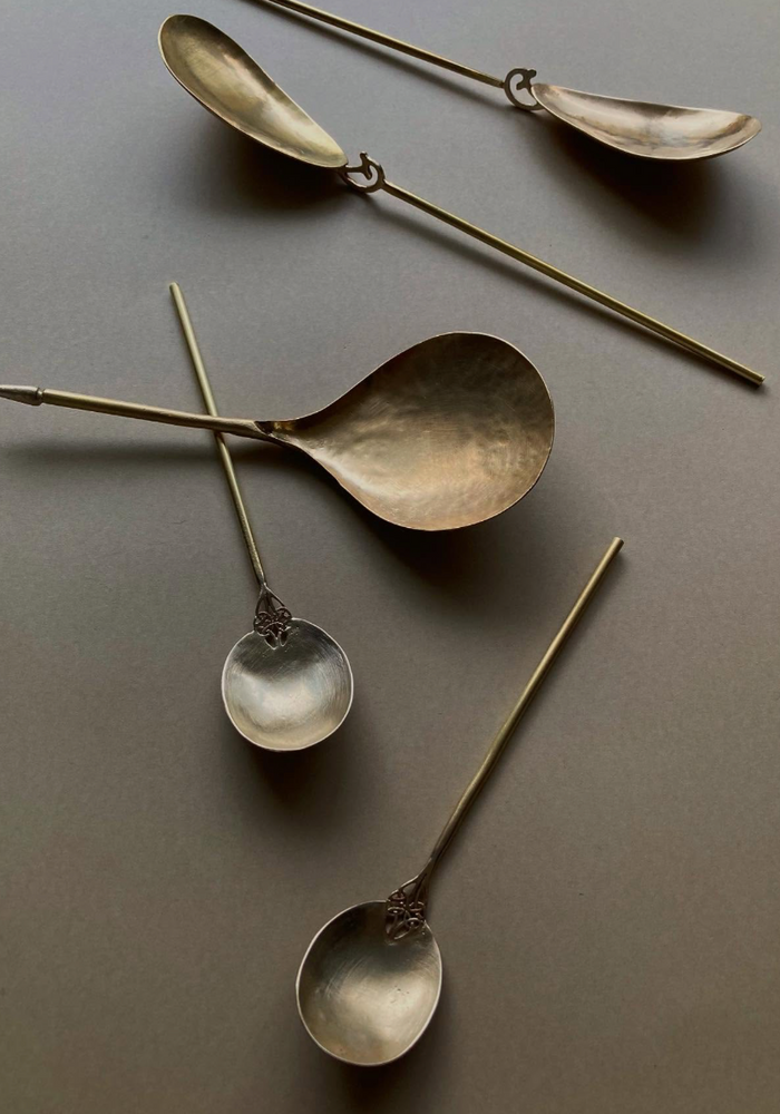 Tea Spoon set featuring handcrafted, hammered bowls with slender stems, created by Misae Nikkei in Kyoto, showcasing unique, decorative designs inspired by daily rituals.